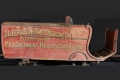 An 1890s red horse-drawn medicine wagon