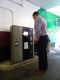 A man putting his ticket in the Pay on Foot machine