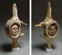 faces carved in whale bone, antler, ivory and stone