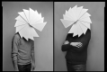 black and white photo, two people with multiple triangles in a spiral replace their heads