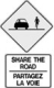 Sign indicating cyclists and motor vehicles should 'share the road'