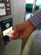Inserting entry ticket in Pay on Foot machine
