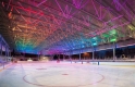 nighttime image of the rink highlighting the coloured lights