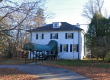Heritage house with front awning at 240 Coltrin Road