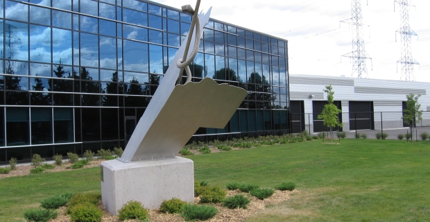 Image of the concrete and steel sculpture installed in front of the building.