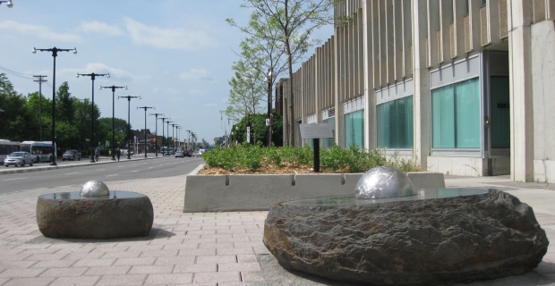 Daytime image of two of the stone and metal sculptures.