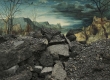 pile of broken asphalt with trees and stormy sky in the background