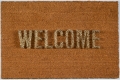 A welcome mat with the word welcome spelled out in porcupine quills facing upward.