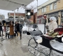 A film set in the ByWard Market featuring a crew, lights a camera and a large sleigh