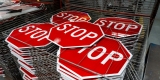 A stack of stop signs waiting to be installed.
