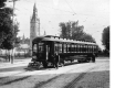 Conductor standing in front of streetcar