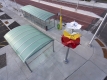 aerial view of a transit station, showing the top of the colourful public art sculpture