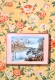 a painted landscape picture set over top of a painted wallpaper background