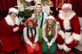 Santa Claus and Mrs. Claus with elves