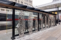 metal sculptures at the rear of transit shelter