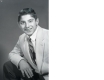 Portrait taken of Paul Anka posing in a suit and tie at 15 years old