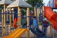Photo 1 - A tot lot provides a place for young children to climb and slide