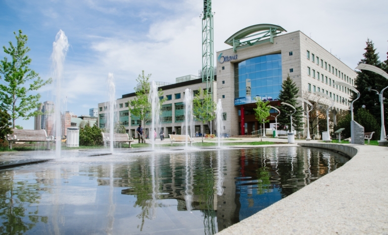 Fountian in forground with Ottawa City Hall's Marion Dewar Plaza in in background