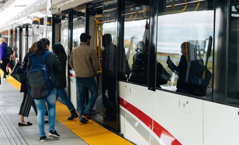 Passengers boarding an LRT train