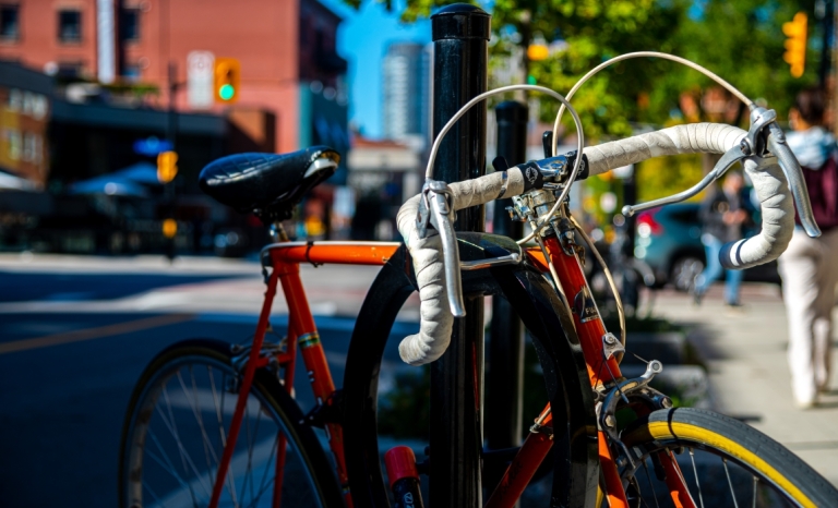 A big locked up at a street side bike stand