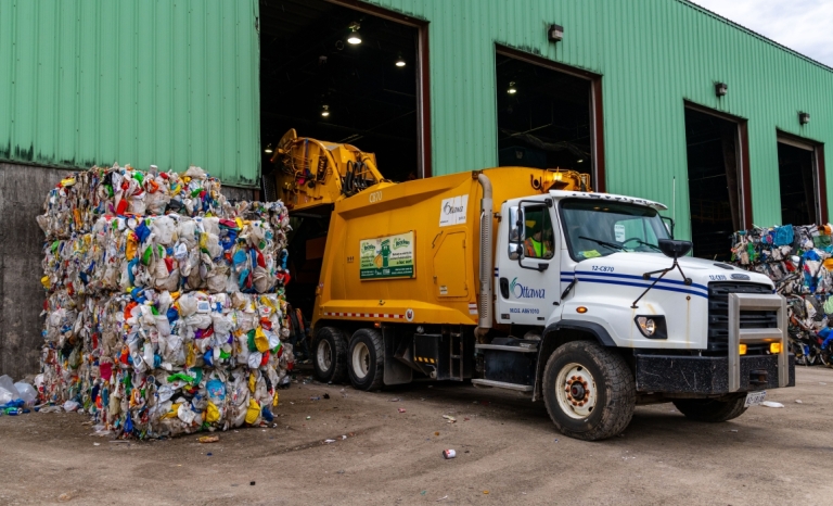 A City owned recycling truck uloading at Cascades Recycling Facility