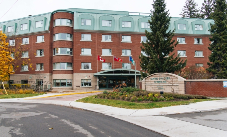 Front entrance and sign of 5 story long term care facility