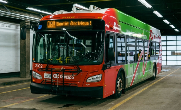 An OC Transpo electric bus on display in the garage