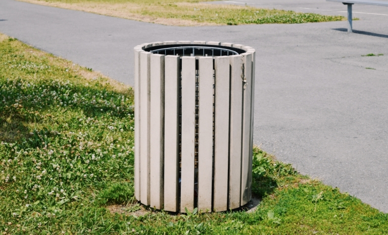 A waste bin in a city park