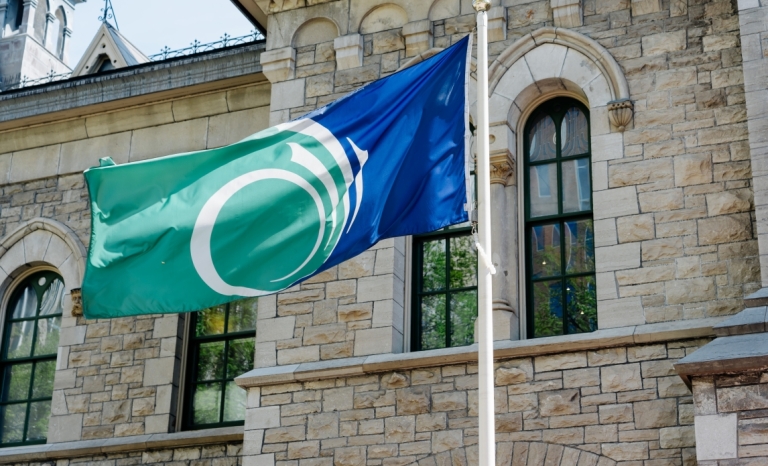 City of Ottawa flag in front of Heritage Building at City Hall