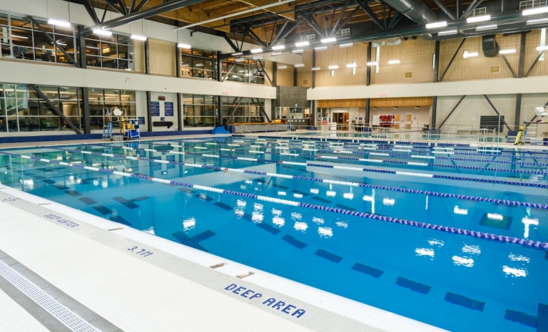 A large indoor pool facility with lane markers