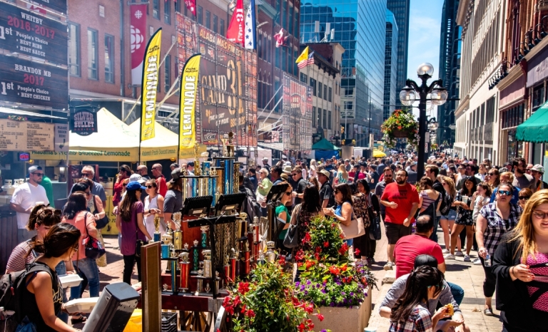 A large crowd of vendors, cooks and visitors at Ribfest on Sparks Street