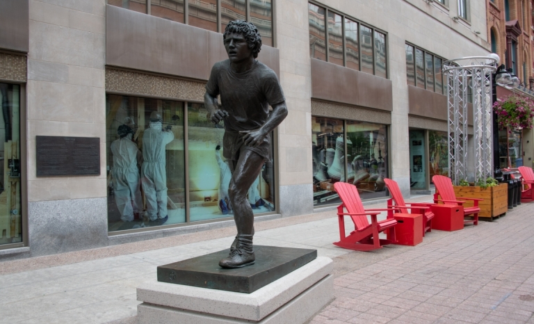 bronze sculpture of Terry Fox in running motion 