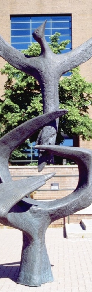 Bronze sculpture of a phoenix rising out of a talon grasp.
