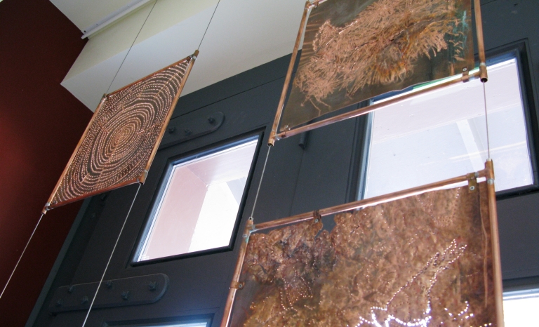 A close-up image of 3 of the copper panels.