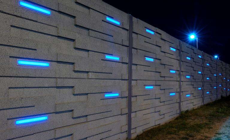 Photo of the wall at night.