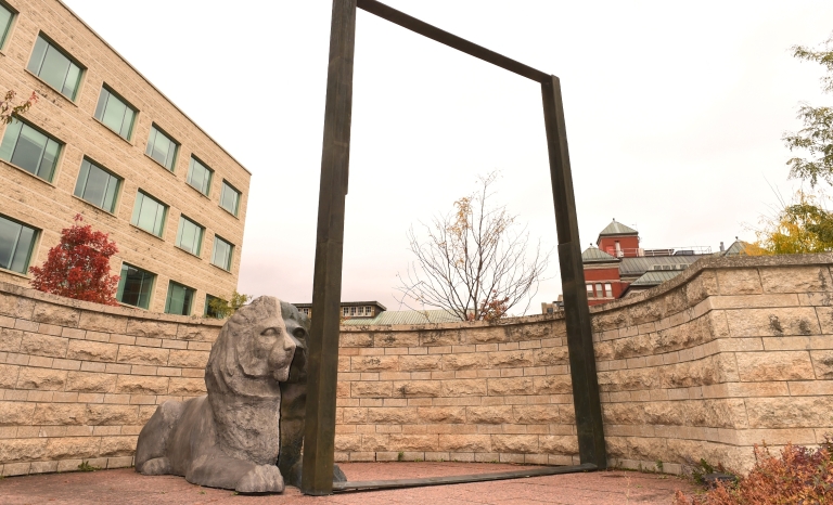 An image of the lion and the frame in the East Courtyard of City Hall.