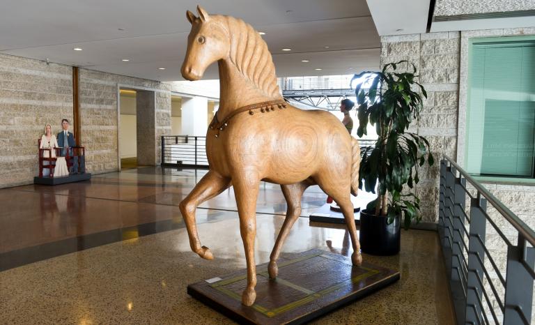 A lifesized stylized sculpture of a horse.