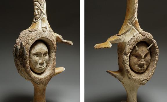 Images of two sculptures of faces, one held in a hand and each with the goddess on the top.