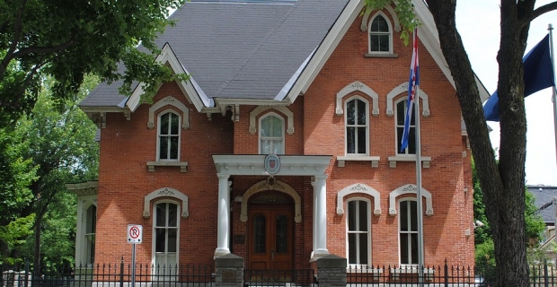 Built in 1875, red brick house stands deep in Sandy Hill, designated as a historical building.