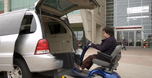 Young person in wheelchair entering Para Transpo van