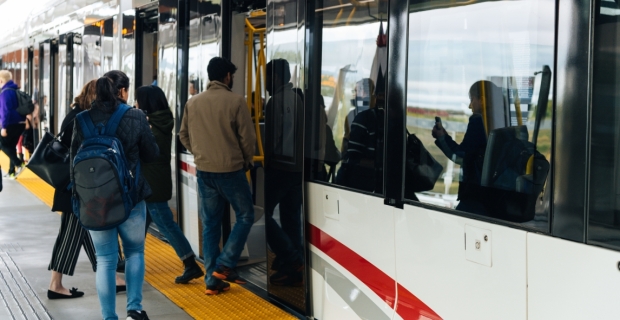 Passengers boarding an LRT train