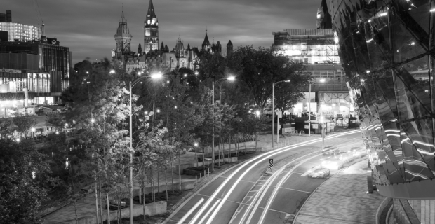 A night time shot of downtown with the Shaw Centre, The Rideau Canal and the Parliament Buildings