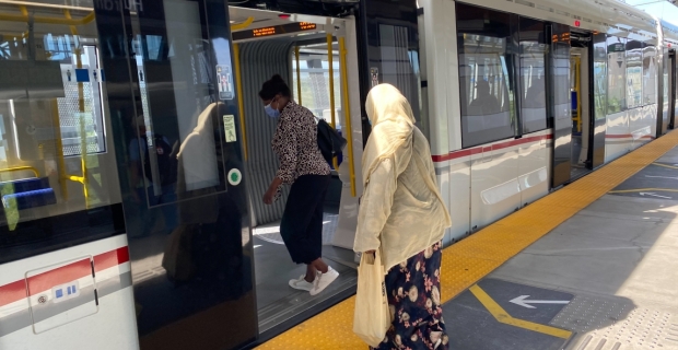 Passengers boarding an LRT train