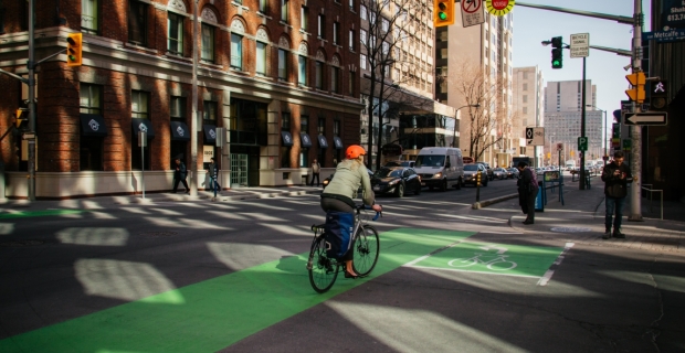 A cyclist travelling in a bike lane on Laurier Ave