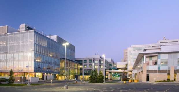 Exterior photo of The Ottawa Hospital General Campus. Cancer research labs are in a glass-walled building.  
