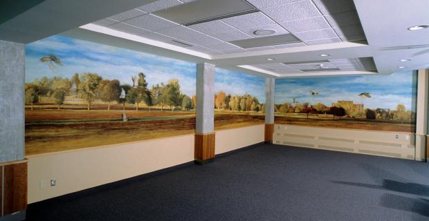 A painted Ottawa landscape expands across two walls. 