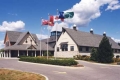 Photo of the building with flags.