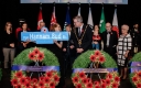 Mayor and guests holding a street sign for Bertram Bud Hannam Street