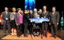 Mayor and guests holding a street sign 