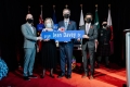 Mayor and guests holding a street sign for Jean Davey Drive